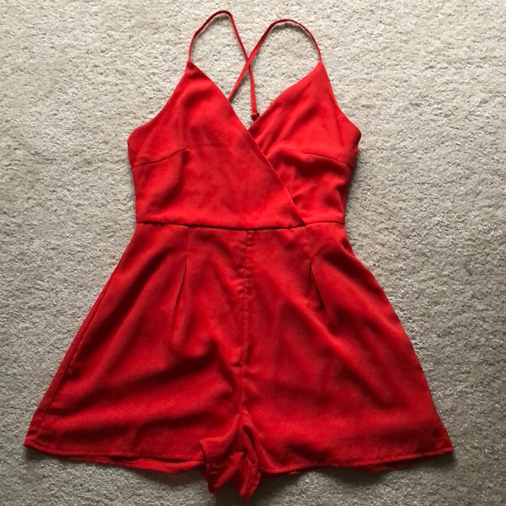 Red romper with cross cross straps